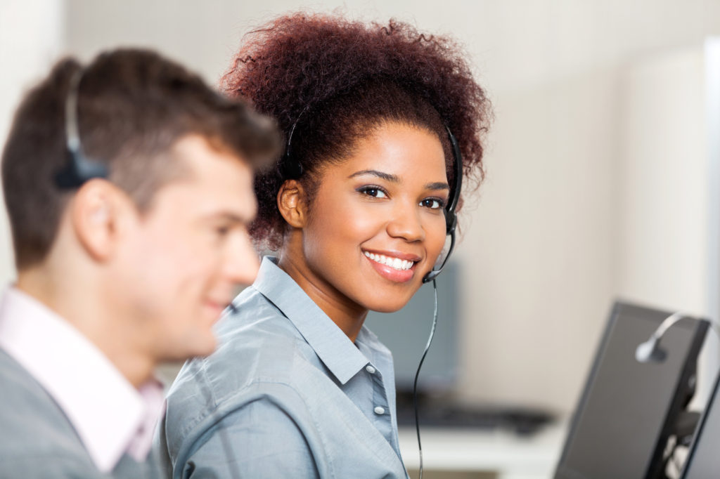 Portrait of smiling female customer service representative working in office